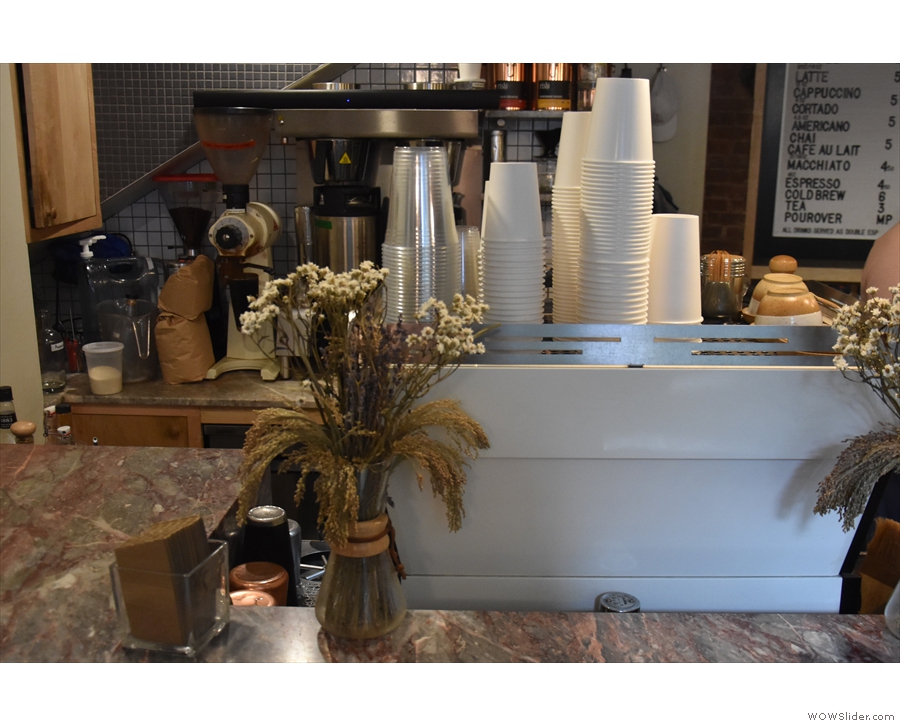 There are more flowers over by the espresso machine, adding to Patent Coffee's charm.