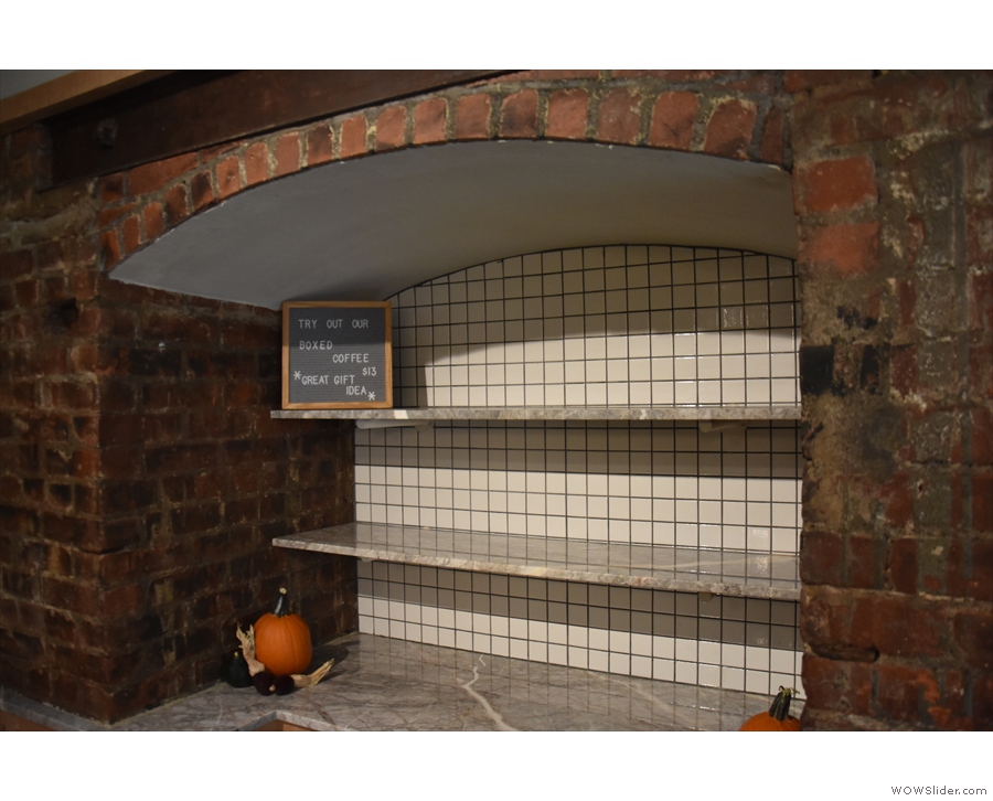 Meanwhile, these shelves were awaiting their autumn (fall) display of pumpkins.