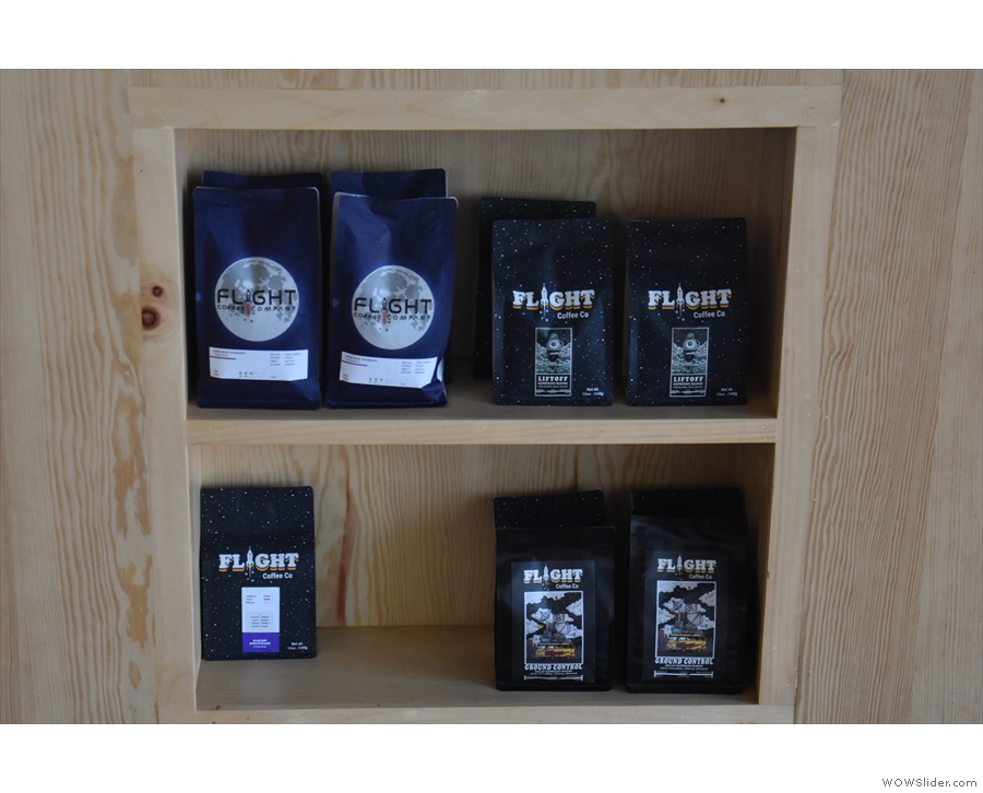 There's also a pair of retail shelves build into the counter with bags of coffee for sale.