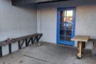 ... but this bench and small table in the recessed door area are still there.