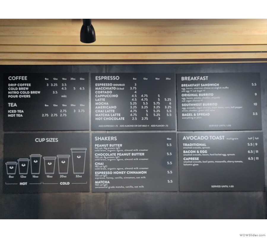 Meanwhile, there are a series of simple menu boards to the left, behind the till.
