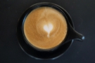... cappuccino, served in a classic black cup, while on my return it was earlier in the day...