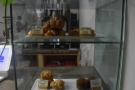 The cakes are in this glass display case on the right-hand end of the counter.