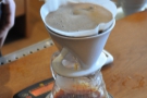 The blurring is because the barista was keeping up a constant circular motion as he poured.