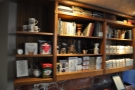 The shelves of coffee and coffee-making kit at the back.