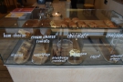 ... a range of cakes and pastries (sweet & savoury) are in a glass display case to the right.