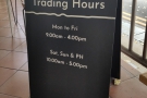 The handy A-board gives the opening hours.