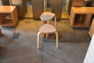 ... with a pair of more conventional stools and their coffee table midway along the wall.