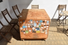 One of the tables is this packing case, which is decorated with stickers from...