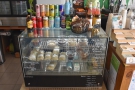 The food is all in this glass display cabinet at the end of the counter.