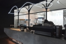The counter, with its unusual angles, is at the back of the coffee shop. Talking of unusual...