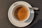 ... served in a classic white cup. Before I left, I kept the coffee-go-round turning by...