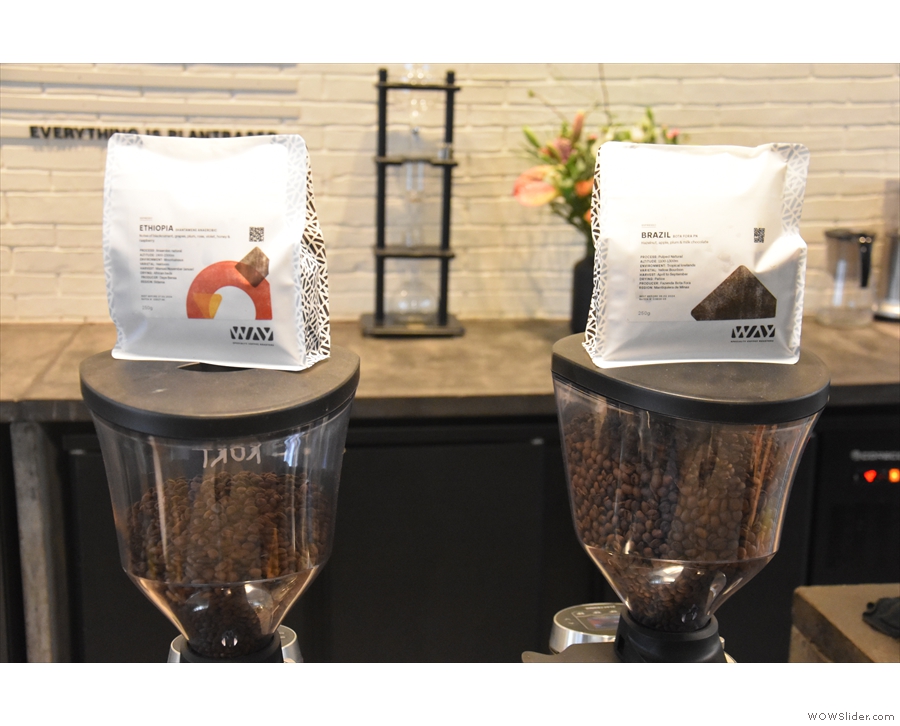The espresso choices are represented by bags of coffee on top of the grinders. 