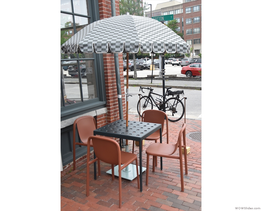 ... you'll find this solitary table for four on the corner.