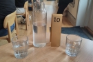 If you are staying, you'll be shown to a table, given a number and a carafe of water...