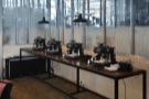 ... while beyond them, along the right-hand wall, is a display of home espresso machines.