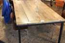 It starts with this eight-person communal table which runs at an angle of 45°.