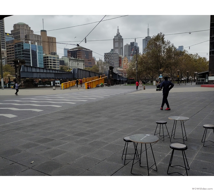 ... where you can sit and admire the views across the square and river to the CBD.
