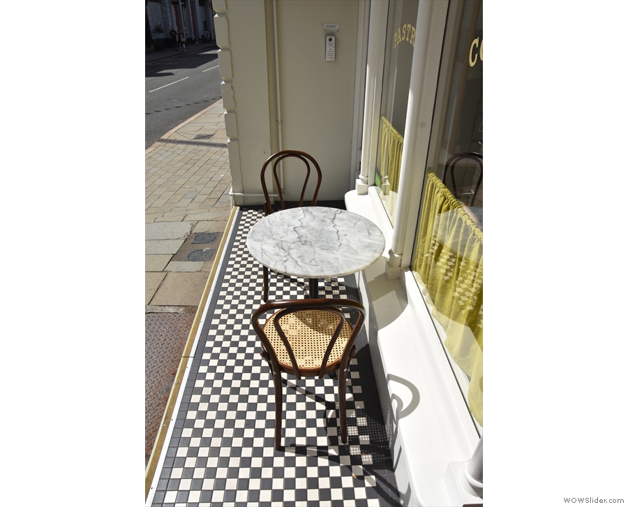 ... room for this two-person table on the tiled threshold, Pont's only seating.