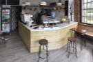 ... running the full width of the coffee shop. Now it's in the back, right-hand corner...