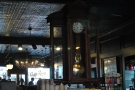 The mirror and the pendulum clock at the back of Caffe Roma.