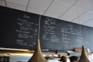 So, to business. The menu is chalked above the counter.