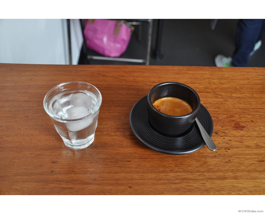 My espresso, which came with its own glass of water.