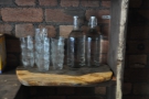 A neat little shelf with bottles of water for you to take to your table.