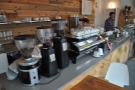 Right, to the coffee. It's a well-stocked counter: grinders, espresso machine, brew bar.