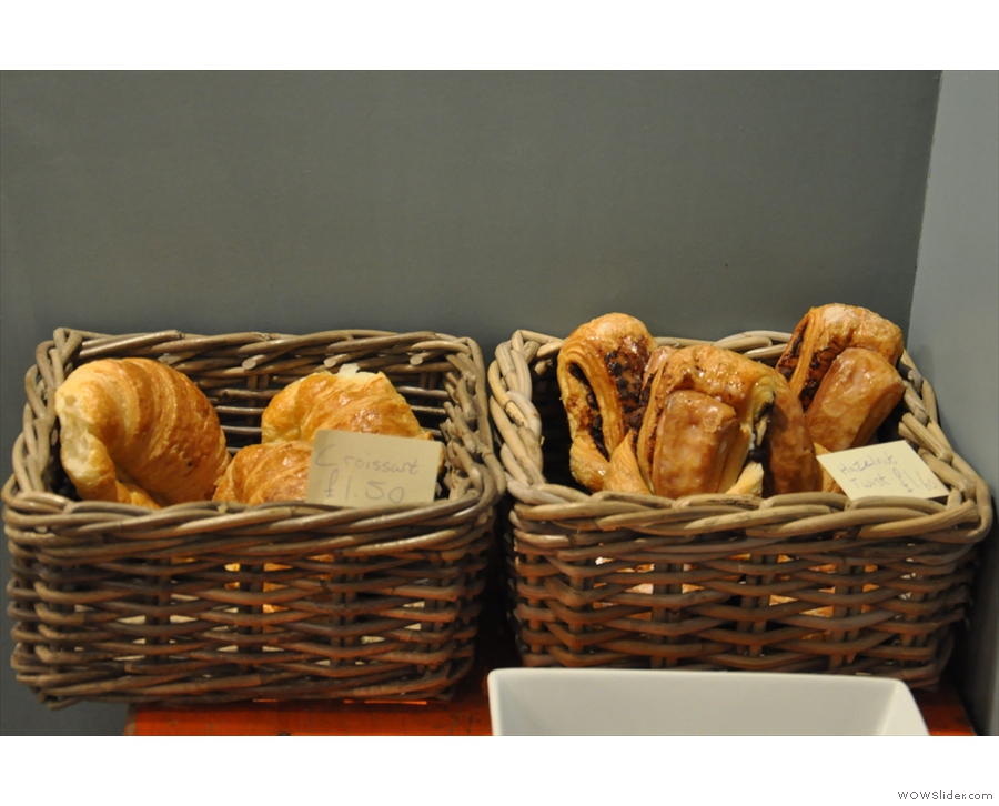 There are also some croissants and other pastries to the right of the counter.