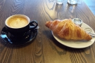 Breakfast: a croissant and flat white.