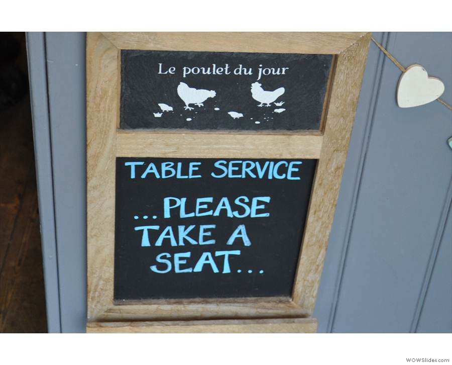 Table service! Rare words to warm anyone's heart! Take a seat, it says...