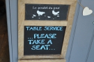 Table service! Rare words to warm anyone's heart! Take a seat, it says...