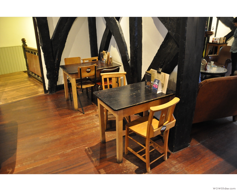 Some of the varied seating available: tables against the wall as you come in...