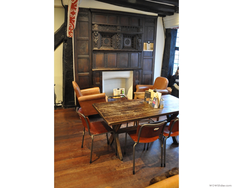 In the centre of the bay, there's this communal table. Best of all is the wonderful fireplace!