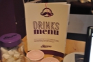 You can find the drinks menu on the table.