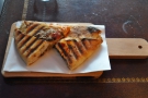 I settled for the Calzone Parmigiano, which came on its own wooden paddle.
