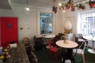 A panoramic view of the lovely downstairs at Daisy Green, even smaller than the upstairs.