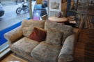 One of the two very comfortable-looking sofas, with a small table squeezed in behind!