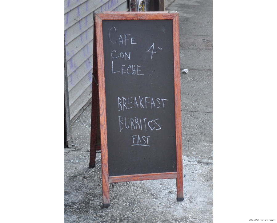 The A-board proudly pronounces the house specialities: Cafe con Leche & breakfast burritos.