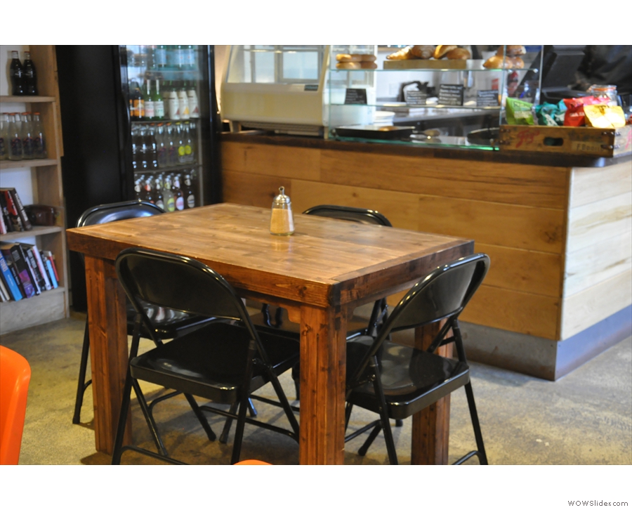 This four-person table sits in glorious isolation between the counter and the bench.