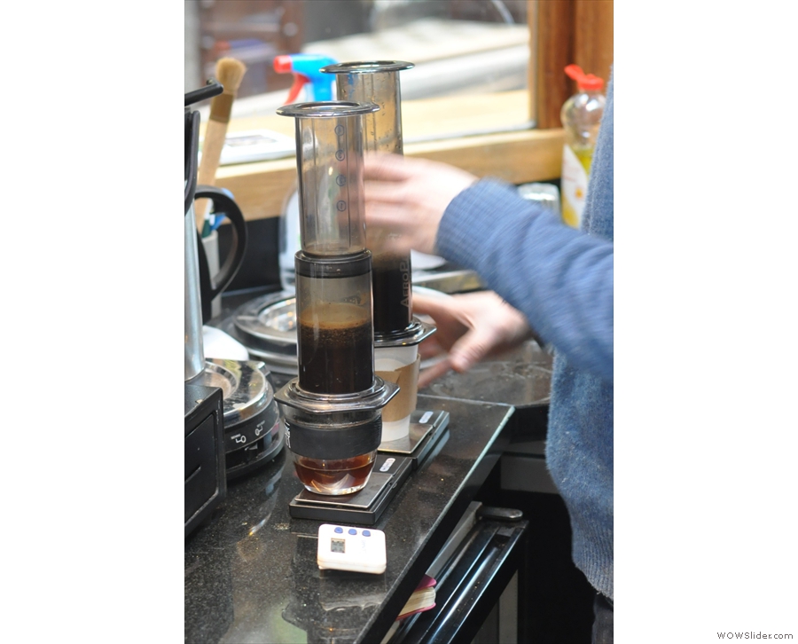 Once they're both full, he pops in the second part of the Aeropress.