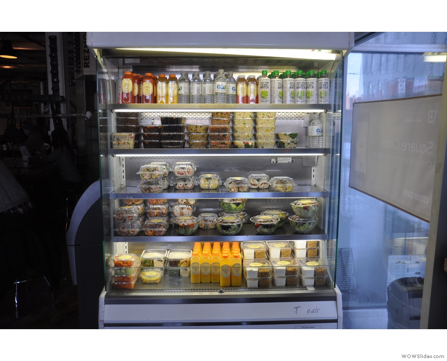 There are soft drinks and salads in a chiller cabinet to your right as you come in...