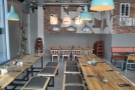 The seating at the far end of KuPP, with more communal tables.