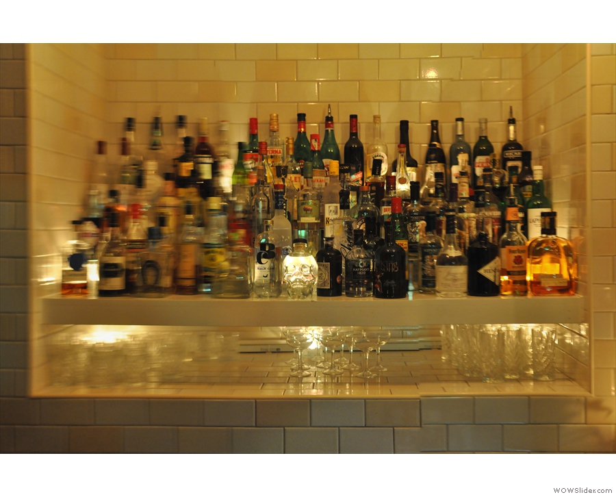 ... revealing a very comprehensively stocked bar...
