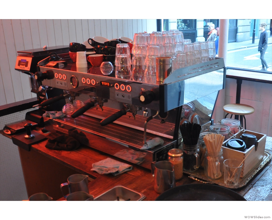 In case you missed it, the La Marzocco is at the front of the counter, opposite the window.