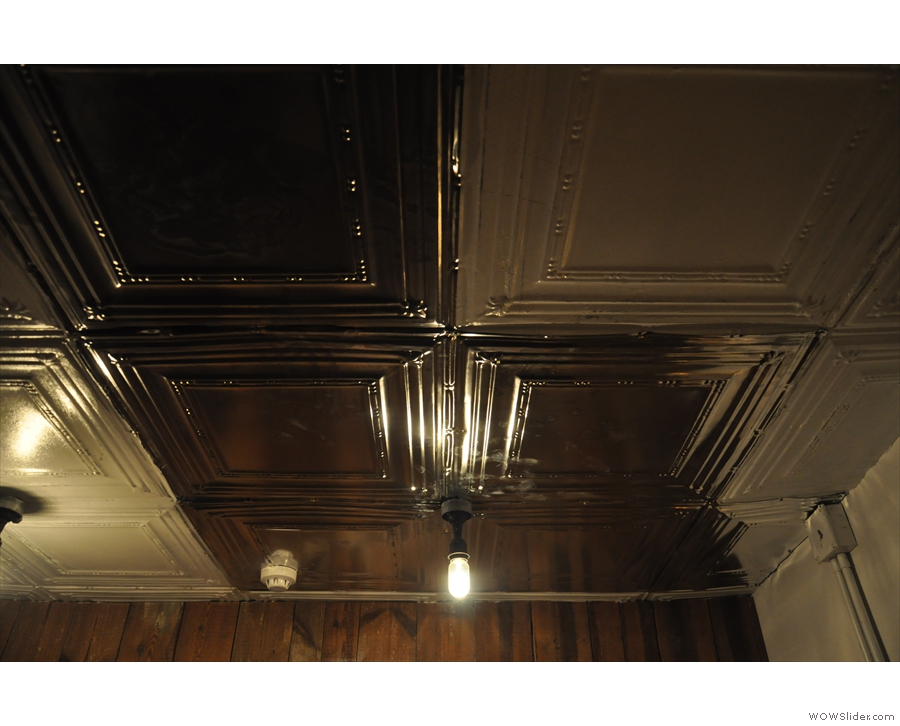 Meanwhile, the basement has a wonderful, tin ceiling. With its own light-bulbs...