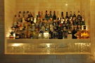 ... revealing a very comprehensively stocked bar...