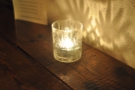 ... by these lovely candles, which sit inside glasses.