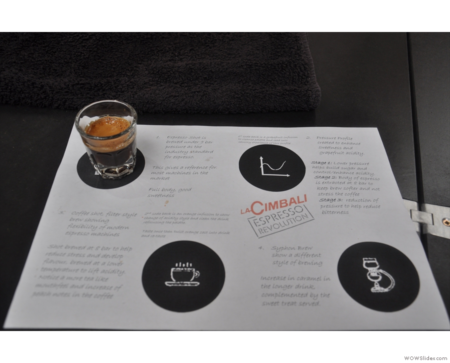 The espresso takes its place on the coffee mat, which comes with explanatory notes.